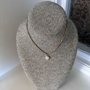 Elegant Gold Necklace with White Pendant